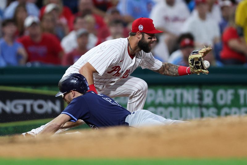 Sep 11, 2024; Philadelphia, Pennsylvania, USA; Tampa Bay Rays second base Brandon Lowe (8) beats out the tag attempt of Philadelphia Phillies outfielder Weston Wilson (37) for a triple during the third inning at Citizens Bank Park. Mandatory Credit: Bill Streicher-Imagn Images