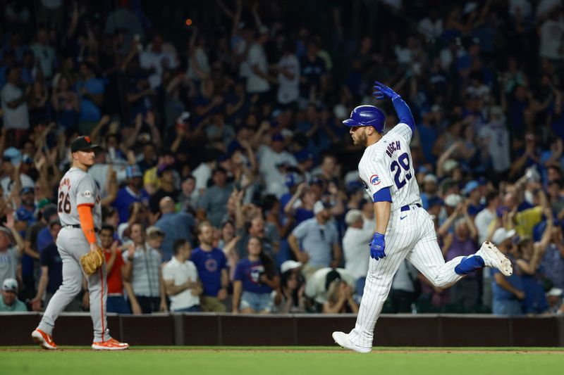 Jun 17, 2024; Chicago, Illinois, USA; Chicago Cubs first baseman Michael Busch (29) rounds the bases after hitting a two-run home run against the San Francisco Giants during the sixth inning at Wrigley Field. Mandatory Credit: Kamil Krzaczynski-USA TODAY Sports