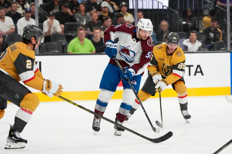 Oct 9, 2024; Las Vegas, Nevada, USA; Colorado Avalanche right wing Nikolai Kovalenko (51) skates against Vegas Golden Knights right wing Victor Olofsson (95) and defenseman Zach Whitecloud (2) during the first period at T-Mobile Arena. Mandatory Credit: Lucas Peltier-Imagn Images