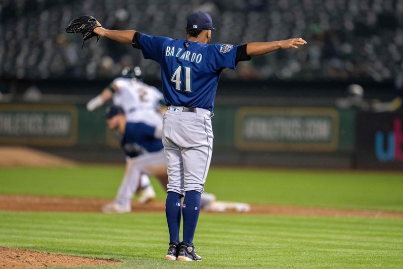 Sep 19, 2023; Oakland, California, USA; Seattle Mariners relief pitcher Eduard Bazardo (41) celebrates after the game against the Oakland Athletics at Oakland-Alameda County Coliseum. Mandatory Credit: Neville E. Guard-USA TODAY Sports