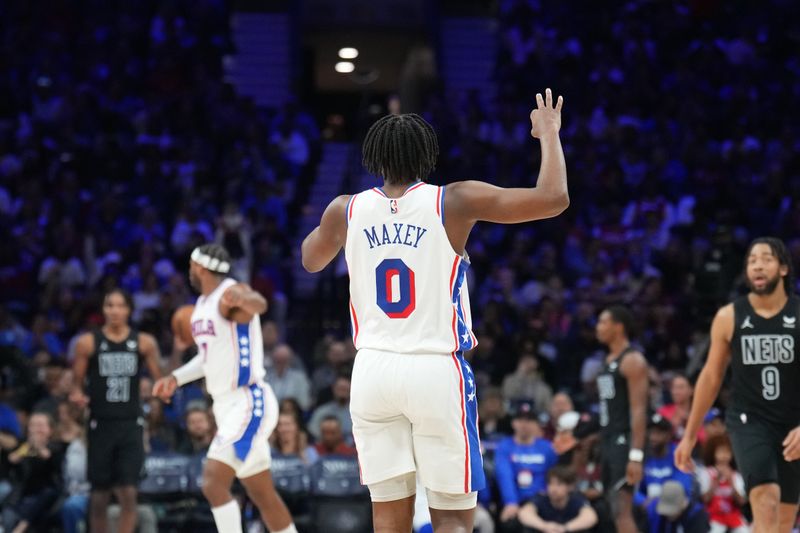 PHILADELPHIA, PA - APRIL 14: Tyrese Maxey #0 of the Philadelphia 76ers celebrates during the game against the Brooklyn Nets on April 14, 2024 at the Wells Fargo Center in Philadelphia, Pennsylvania NOTE TO USER: User expressly acknowledges and agrees that, by downloading and/or using this Photograph, user is consenting to the terms and conditions of the Getty Images License Agreement. Mandatory Copyright Notice: Copyright 2024 NBAE (Photo by Jesse D. Garrabrant/NBAE via Getty Images)