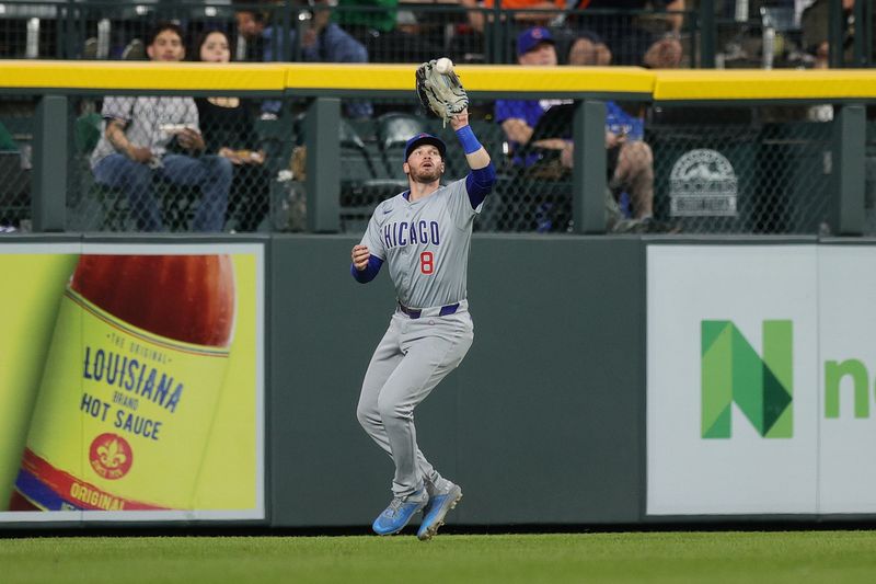 Sep 13, 2024; Denver, Colorado, USA; Chicago Cubs left fielder Ian Happ (8) makes a catch in the third inning against the Colorado Rockies at Coors Field. Mandatory Credit: Isaiah J. Downing-Imagn Images