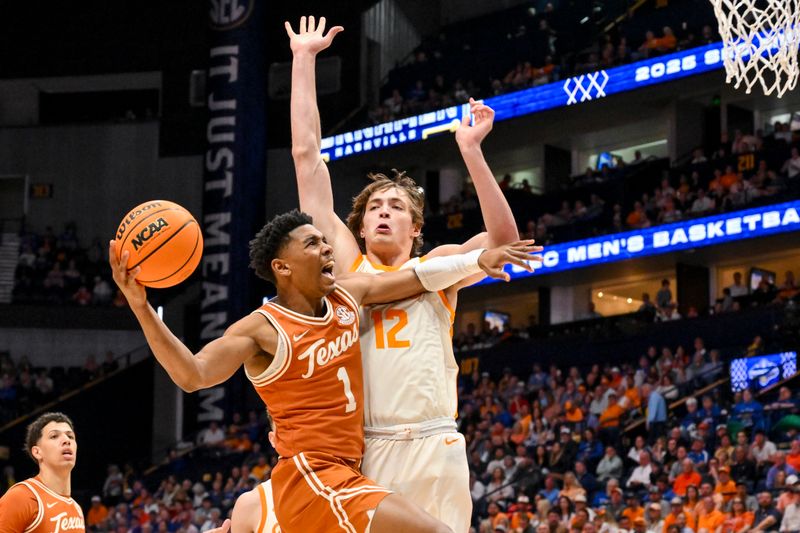 Mar 14, 2025; Nashville, TN, USA;  Texas Longhorns guard Julian Larry (1) shoots over  Tennessee Volunteers forward Cade Phillips (12) during the second half at Bridgestone Arena. Mandatory Credit: Steve Roberts-Imagn Images
