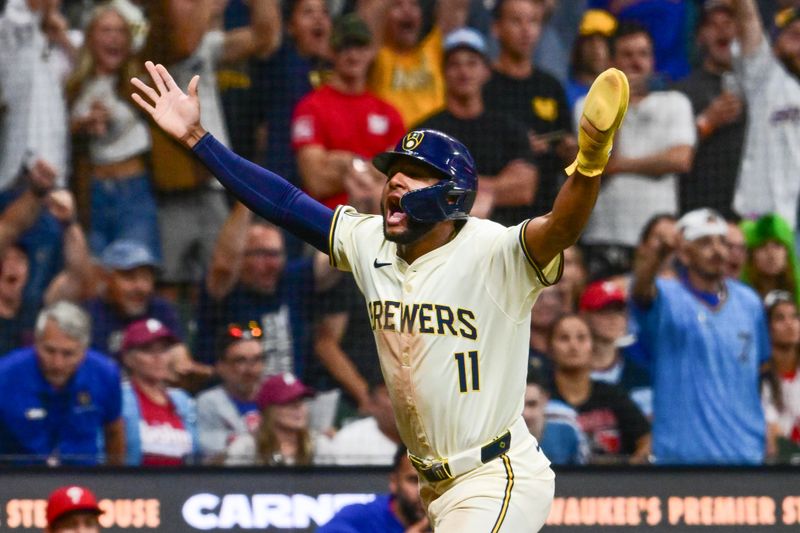 Sep 18, 2024; Milwaukee, Wisconsin, USA; Milwaukee Brewers left fielder Jackson Chourio (11) reacts after scoring the winning run in the ninth inning against the Philadelphia Phillies at American Family Field. Mandatory Credit: Benny Sieu-Imagn Images