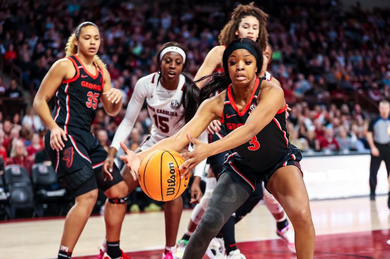 Feb 26, 2023; Columbia, South Carolina, USA; Georgia Lady Bulldogs guard Diamond Battles (3) grabs a rebound against the South Carolina Gamecocks in the first half at Colonial Life Arena. Mandatory Credit: Jeff Blake-USA TODAY Sports