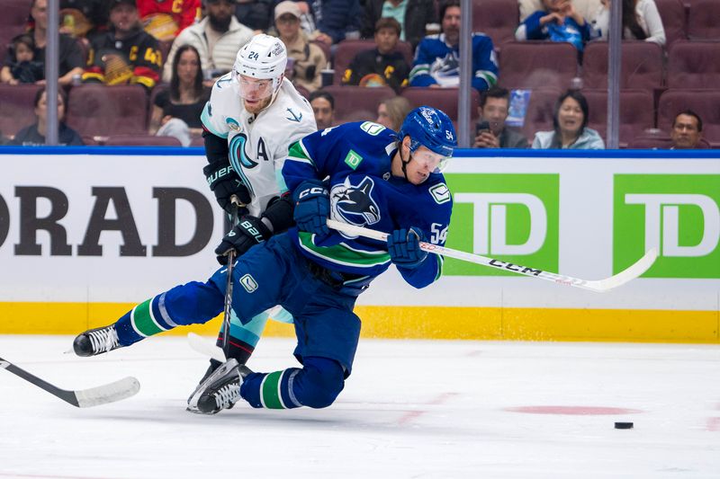 Sep 24, 2024; Vancouver, British Columbia, CAN; Seattle Kraken defenseman Jamie Oleksiak (24) trips Vancouver Canucks forward Aatu Raty (54) during the third period at Rogers Arena. Mandatory Credit: Bob Frid-Imagn Images