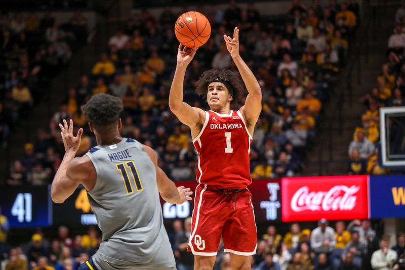 Feb 4, 2023; Morgantown, West Virginia, USA; Oklahoma Sooners forward Jalen Hill (1) shoots over West Virginia Mountaineers forward Mohamed Wague (11) during the first half at WVU Coliseum. Mandatory Credit: Ben Queen-USA TODAY Sports