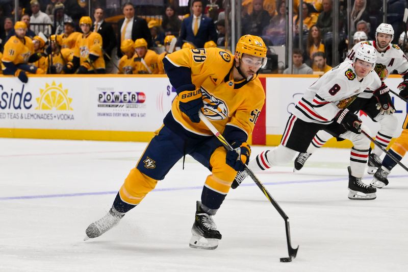Feb 26, 2026; Nashville, Tennessee, USA;  Nashville Predators left wing Michael Bunting (58) breaks his stick against the Chicago Blackhawks during the first period at Bridgestone Arena. Mandatory Credit: Steve Roberts-Imagn Images