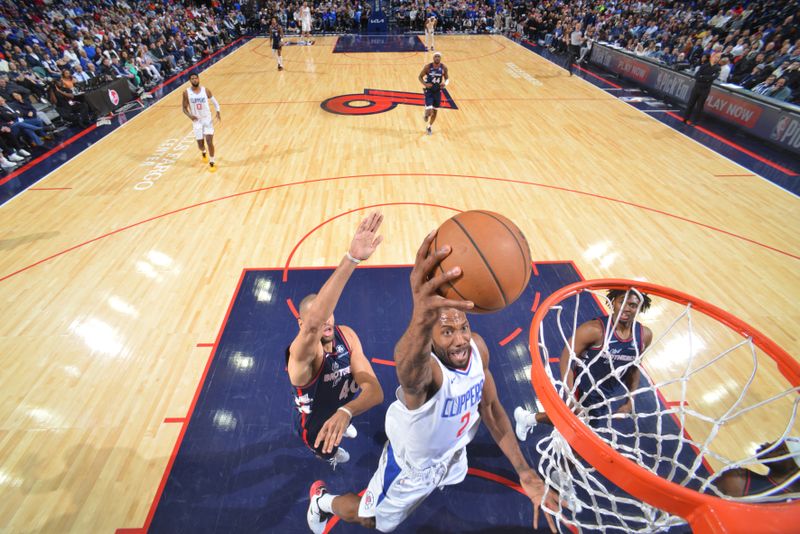 PHILADELPHIA, PA - MARCH 27: Kawhi Leonard #2 of the LA Clippers dunks the ball during the game against the Philadelphia 76ers on March 27, 2024 at the Wells Fargo Center in Philadelphia, Pennsylvania NOTE TO USER: User expressly acknowledges and agrees that, by downloading and/or using this Photograph, user is consenting to the terms and conditions of the Getty Images License Agreement. Mandatory Copyright Notice: Copyright 2024 NBAE (Photo by Jesse D. Garrabrant/NBAE via Getty Images)