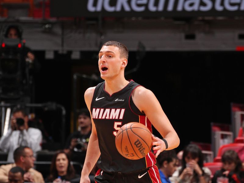 MIAMI, FL - MARCH 2: Nikola Jovic #5 of the Miami Heat brings the ball up court during the game against the Utah Jazz on March 2, 2024 at Kaseya Center in Miami, Florida. NOTE TO USER: User expressly acknowledges and agrees that, by downloading and or using this Photograph, user is consenting to the terms and conditions of the Getty Images License Agreement. Mandatory Copyright Notice: Copyright 2024 NBAE (Photo by Issac Baldizon/NBAE via Getty Images)