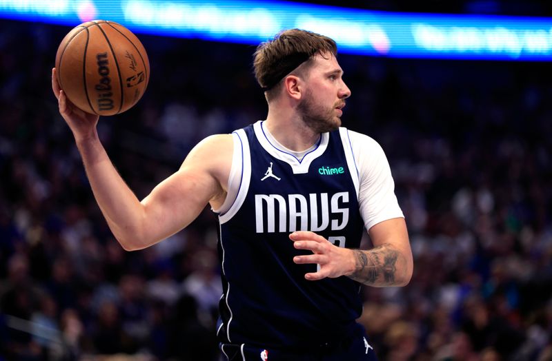 DALLAS, TX - JANUARY 27: Luka Doncic #77 of the Dallas Mavericks looks to pass against the Sacramento Kings in the first half at American Airlines Center on January 27, 2024 in Dallas, Texas. NOTE TO USER: User expressly acknowledges and agrees that, by downloading and or using this photograph, User is consenting to the terms and conditions of the Getty Images License Agreement. (Photo by Ron Jenkins/Getty Images)