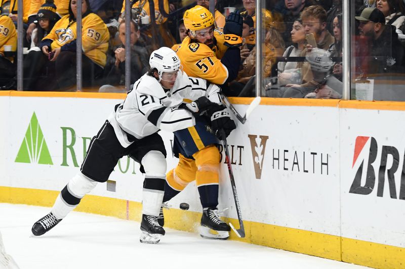 Jan 31, 2024; Nashville, Tennessee, USA; Nashville Predators defenseman Dante Fabbro (57) is hit by Los Angeles Kings defenseman Jordan Spence (21) during the third period at Bridgestone Arena. Mandatory Credit: Christopher Hanewinckel-USA TODAY Sports