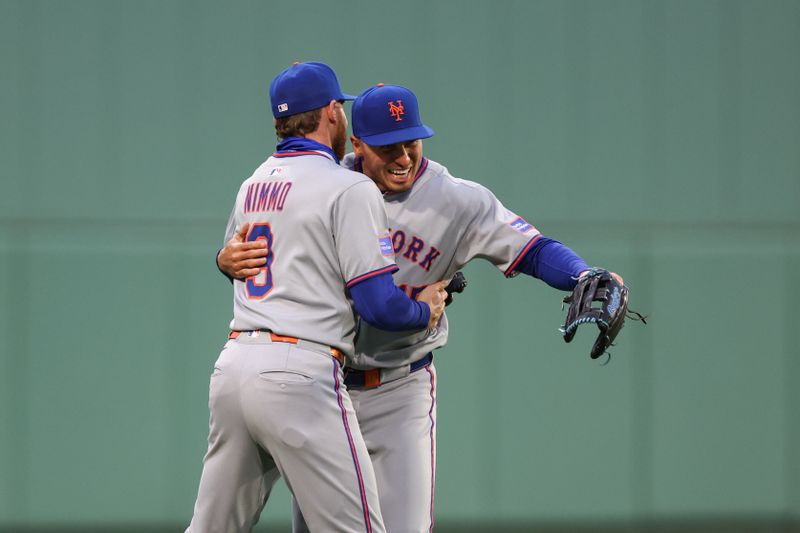 May 20, 2025; Boston, Massachusetts, USA; New York Mets left fielder Brandon Nimmo (9) and New York Mets center fielder Tyrone Taylor (15) celebrate after Nimmo threw out Boston Red Sox first baseman Nick Sogard (20) during the second inning at Fenway Park. Mandatory Credit: Paul Rutherford-Imagn Images