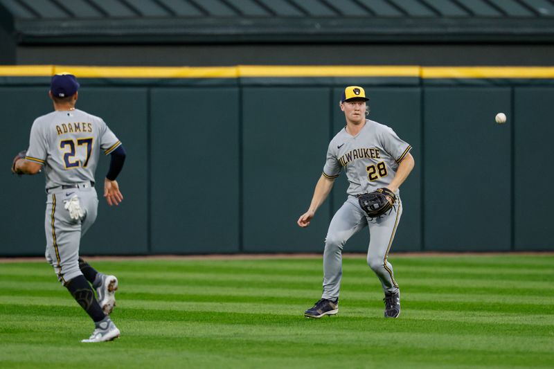 Aug 11, 2023; Chicago, Illinois, USA; Milwaukee Brewers center fielder Joey Wiemer (28) is unable to catch a ball hit by Chicago White Sox first baseman Andrew Vaughn (not pictured) during the first inning at Guaranteed Rate Field. Mandatory Credit: Kamil Krzaczynski-USA TODAY Sports