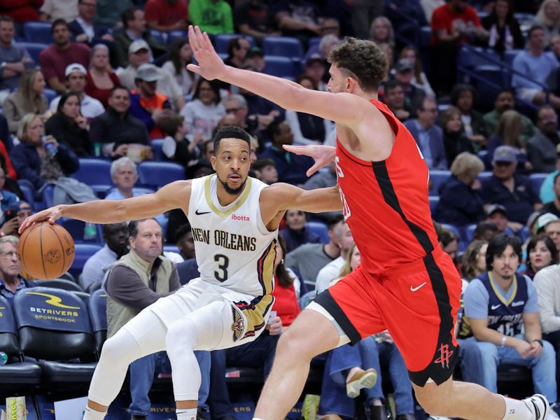 NEW ORLEANS, LOUISIANA - FEBRUARY 22: CJ McCollum #3 of the New Orleans Pelicans drives against Alperen Sengun #28 of the Houston Rockets during the second half at the Smoothie King Center on February 22, 2024 in New Orleans, Louisiana. NOTE TO USER: User expressly acknowledges and agrees that, by downloading and or using this Photograph, user is consenting to the terms and conditions of the Getty Images License Agreement. (Photo by Jonathan Bachman/Getty Images)