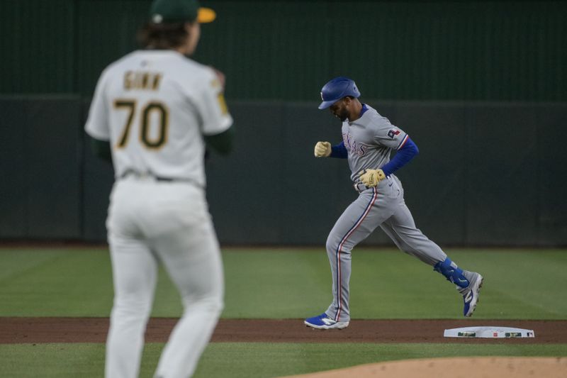 Apr 24, 2025; West Sacramento, California, USA; Texas Rangers outfielder Leody Taveras (3) rounds second base after hitting a home run off of Athletics pitcher J.T. Ginn (70) during the fourth inning at Sutter Health Park. Mandatory Credit: Ed Szczepanski-Imagn Images