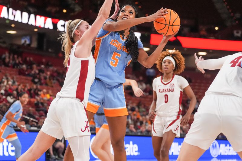 Mar 8, 2024; Greensville, SC, USA;  Tennessee Lady Vols guard Kaiya Wynn (5) shoots against Alabama Crimson Tide guard Sarah Ashlee Barker (3) during the second half at Bon Secours Wellness Arena. Mandatory Credit: Jim Dedmon-USA TODAY Sports