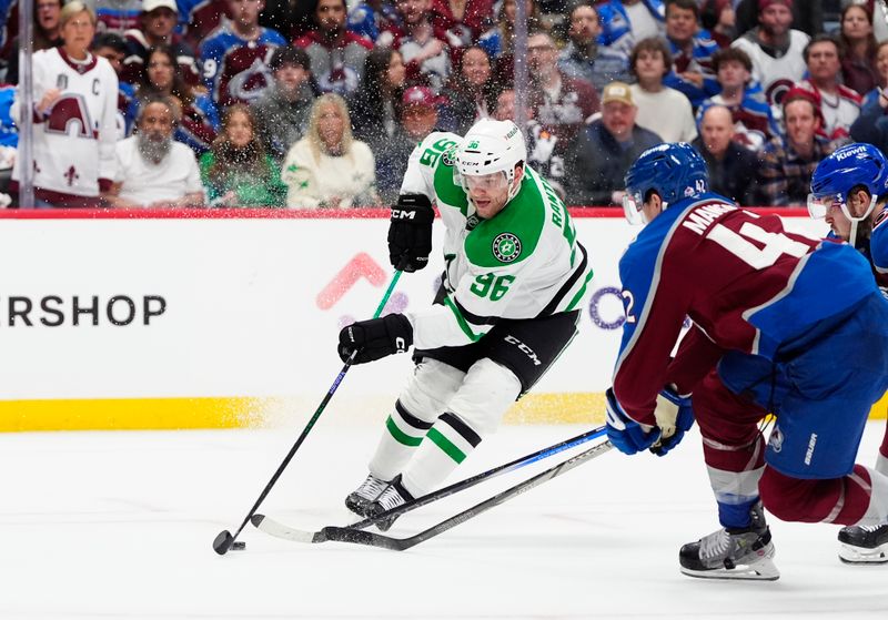 May 1, 2025; Denver, Colorado, USA; Dallas Stars right wing Mikko Rantanen (96) controls the puck against the Colorado Avalanche in the third period in game six of the first round of the 2025 Stanley Cup Playoffs at Ball Arena. Mandatory Credit: Ron Chenoy-Imagn Images
