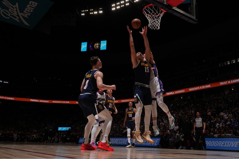 DENVER, CO - FEBRUARY 14: Nikola Jokic #15 of the Denver Nuggets rebounds the ball during the game against the Sacramento Kings on February 14, 2024 at the Ball Arena in Denver, Colorado. NOTE TO USER: User expressly acknowledges and agrees that, by downloading and/or using this Photograph, user is consenting to the terms and conditions of the Getty Images License Agreement. Mandatory Copyright Notice: Copyright 2024 NBAE (Photo by Bart Young/NBAE via Getty Images)