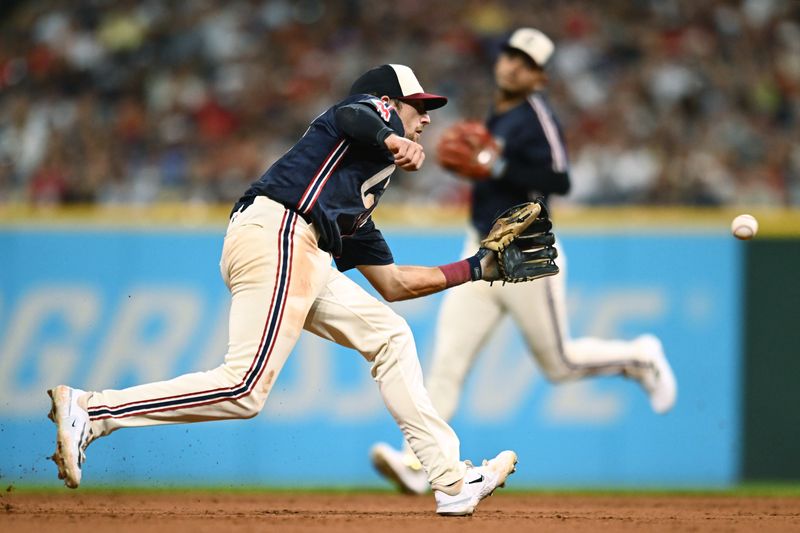 Aug 3, 2024; Cleveland, Ohio, USA; Cleveland Guardians shortstop Daniel Schneemann (10) fields a ball hit by Baltimore Orioles catcher James McCann (not pictured) during the eighth inning at Progressive Field. Mandatory Credit: Ken Blaze-USA TODAY Sports