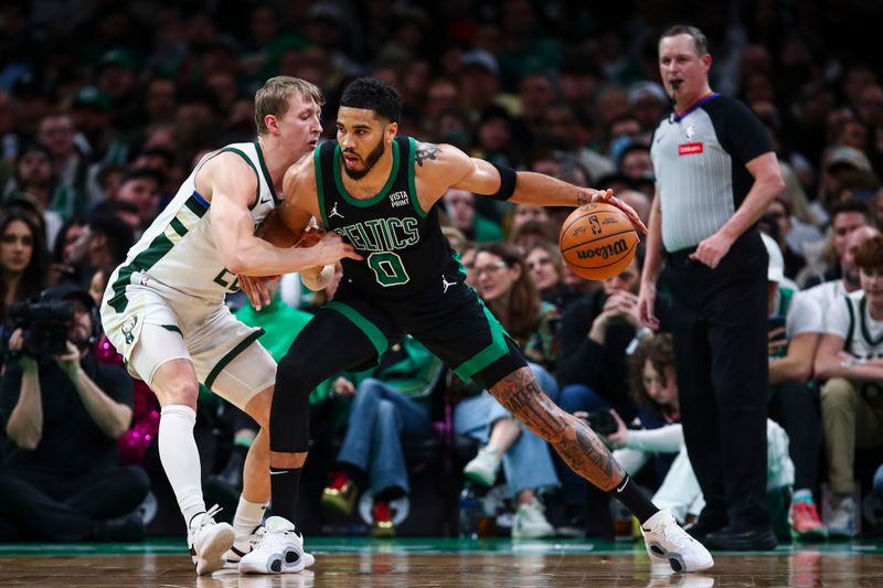 BOSTON, MA - MARCH 20: Jayson Tatum #0 of the Boston Celtics posts up against AJ Green #20 of the Milwaukee Bucks in the first half at TD Garden on March 20, 2024 in Boston, Massachusetts. NOTE TO USER: User expressly acknowledges and agrees that, by downloading and or using this photograph, User is consenting to the terms and conditions of the Getty Images License Agreement. (Photo by Adam Glanzman/Getty Images)