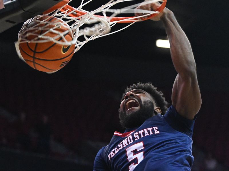 Feb 3, 2023; Las Vegas, Nevada, USA; Fresno State Bulldogs guard Jordan Campbell (5) dunks the ball on the UNLV Runnin' Rebels in the second half at Thomas & Mack Center. Mandatory Credit: Candice Ward-USA TODAY Sports