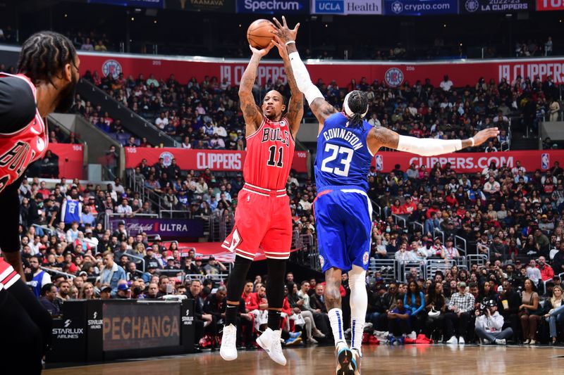 LOS ANGELES, CA - MARCH 27: DeMar DeRozan #11 of the Chicago Bulls shoots the ball during the game against the LA Clippers on March 27, 2023 at Crypto.Com Arena in Los Angeles, California. NOTE TO USER: User expressly acknowledges and agrees that, by downloading and/or using this Photograph, user is consenting to the terms and conditions of the Getty Images License Agreement. Mandatory Copyright Notice: Copyright 2023 NBAE (Photo by Adam Pantozzi/NBAE via Getty Images)