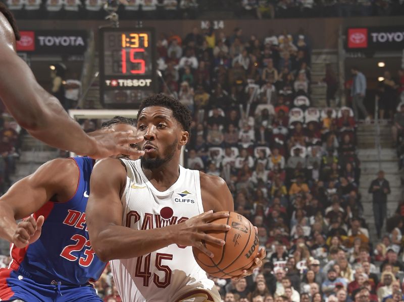 CLEVELAND, OH - OCTOBER 25: Donovan Mitchell #45 of the Cleveland Cavaliers drives to the basket during the game against the Detroit Pistons on October 25, 2024 at Rocket Mortgage FieldHouse in Cleveland, Ohio. NOTE TO USER: User expressly acknowledges and agrees that, by downloading and/or using this Photograph, user is consenting to the terms and conditions of the Getty Images License Agreement. Mandatory Copyright Notice: Copyright 2024 NBAE (Photo by David Liam Kyle/NBAE via Getty Images)