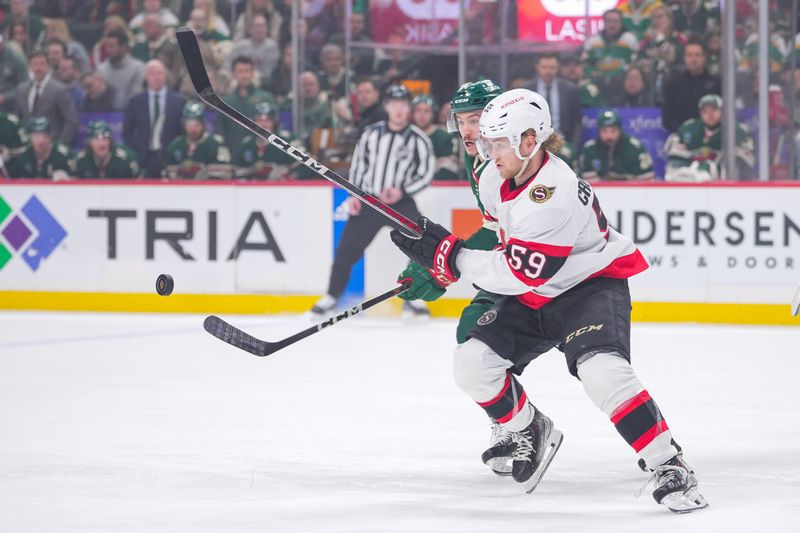 Apr 2, 2024; Saint Paul, Minnesota, USA; Ottawa Senators left wing Angus Crookshank (59) plays the puck against the Minnesota Wild in the first period at Xcel Energy Center. Mandatory Credit: Brad Rempel-USA TODAY Sports