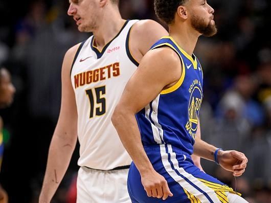 DENVER, CO - DECEMBER 25: Nikola Jokic (15) of the Denver Nuggets and Stephen Curry (30) of the Golden State Warriors lead their teams during the second quarter at Ball Arena in Denver on Monday, December 25, 2023. (Photo by AAron Ontiveroz/The Denver Post)