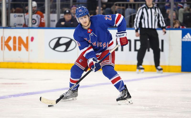 Apr 11, 2024; New York, New York, USA; New York Rangers defenseman Adam Fox (23) passes the puck against the Philadelphia Flyers during the first period at Madison Square Garden. Mandatory Credit: Danny Wild-USA TODAY Sports