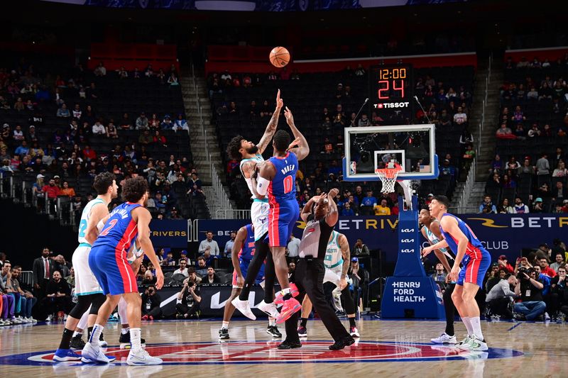 DETROIT, MI - MARCH 11: Nick Richards #4 of the Charlotte Hornets and Jalen Duren #0 of the Detroit Pistons go up for a jump ball  on March 11, 2024 at Little Caesars Arena in Detroit, Michigan. NOTE TO USER: User expressly acknowledges and agrees that, by downloading and/or using this photograph, User is consenting to the terms and conditions of the Getty Images License Agreement. Mandatory Copyright Notice: Copyright 2024 NBAE (Photo by Chris Schwegler/NBAE via Getty Images)