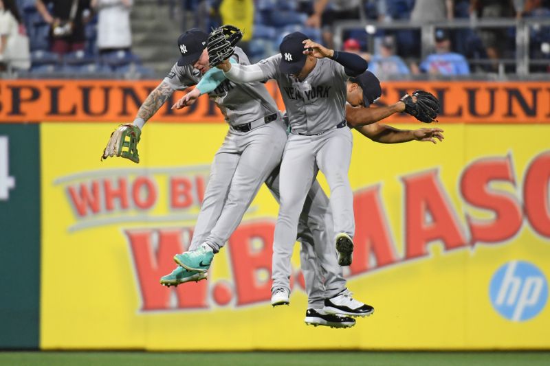 Jul 29, 2024; Philadelphia, Pennsylvania, USA; New York Yankees outfielder Alex Verdugo (24), outfielder Juan Soto (22) and outfielder Trent Grisham (12) celebrate win against the Philadelphia Phillies at Citizens Bank Park. Mandatory Credit: Eric Hartline-USA TODAY Sports