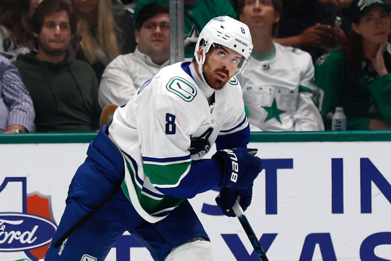 Oct 16, 2025; Dallas, Texas, USA; Vancouver Canucks right wing Conor Garland (8) reacts after scoring a goal against the Dallas Stars during the second period at American Airlines Center. Mandatory Credit: Chris Jones-Imagn Images