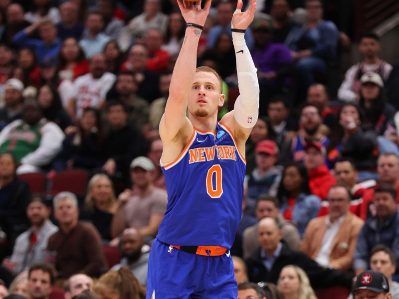 CHICAGO, ILLINOIS - APRIL 09: Donte DiVincenzo #0 of the New York Knicks shoots a three pointer against the Chicago Bulls during the first half at the United Center on April 09, 2024 in Chicago, Illinois. NOTE TO USER: User expressly acknowledges and agrees that, by downloading and or using this photograph, User is consenting to the terms and conditions of the Getty Images License Agreement.  (Photo by Michael Reaves/Getty Images)