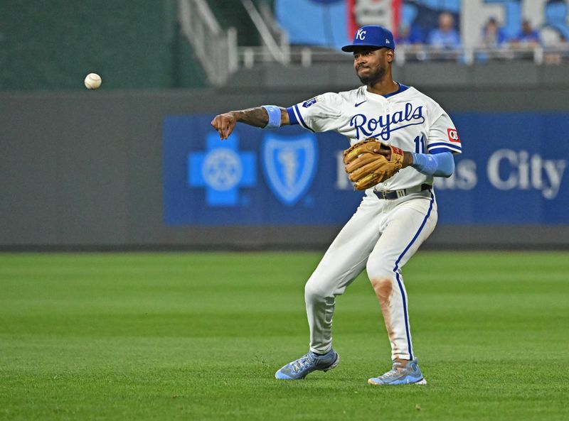 Jun 27, 2024; Kansas City, Missouri, USA;  Kansas City Royals second baseman Maikel Garcia (11) throws the ball to first base for an out in the ninth inning against the Cleveland Guardians at Kauffman Stadium. Mandatory Credit: Peter Aiken-USA TODAY Sports