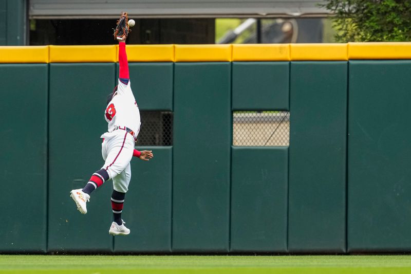 Apr 11, 2024; Cumberland, Georgia, USA; Atlanta Braves center fielder Michael Harris II can’t catch a double hit by (23) New York Mets left fielder Brandon Nimmo (9) (not pictured) during the second inning at Truist Park. Mandatory Credit: Dale Zanine-USA TODAY Sports