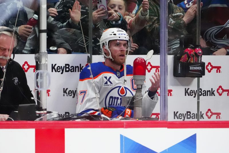 Nov 30, 2024; Denver, Colorado, USA; Edmonton Oilers center Connor McDavid (97) reacts from the penalty box in the second period against the Edmonton Oilers at Ball Arena. Mandatory Credit: Ron Chenoy-Imagn Images