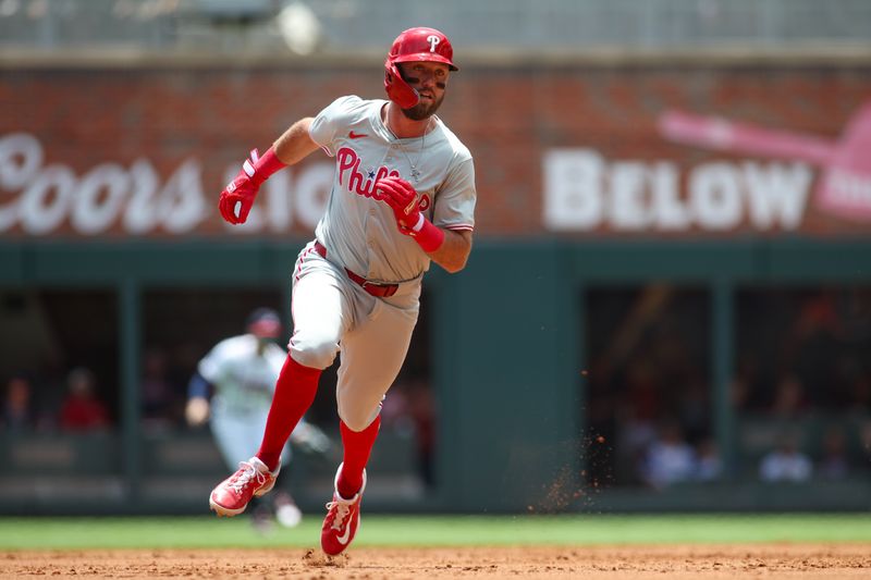 Jul 7, 2024; Atlanta, Georgia, USA; Philadelphia Phillies first baseman Kody Clemens (2) runs to third against the Atlanta Braves in the second inning at Truist Park. Mandatory Credit: Brett Davis-USA TODAY Sports