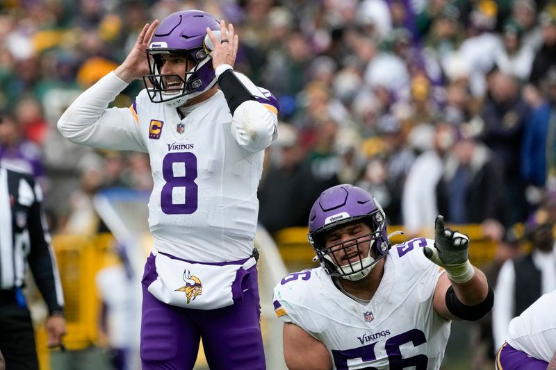 Minnesota Vikings' Kirk Cousins at the line during the second half of an NFL football game against the Green Bay Packers Sunday, Oct. 29, 2023, in Green Bay, Wis. (AP Photo/Morry Gash)