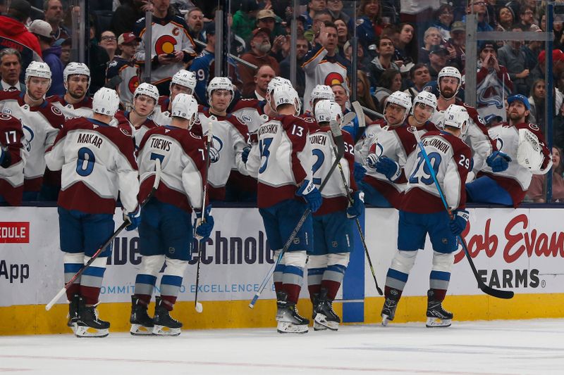 Apr 3, 2025; Columbus, Ohio, USA; Colorado Avalanche center Nathan MacKinnon (29) celebrates his goal with the bench during the first period against the Columbus Blue Jackets at Nationwide Arena. Mandatory Credit: Russell LaBounty-Imagn Images