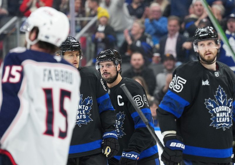 Jan 22, 2025; Toronto, Ontario, CAN; Toronto Maple Leafs center Auston Matthews (34) scores a goal and celebrates with right wing William Nylander (88) against the Columbus Blue Jackets during the third period at Scotiabank Arena. Mandatory Credit: Nick Turchiaro-Imagn Images