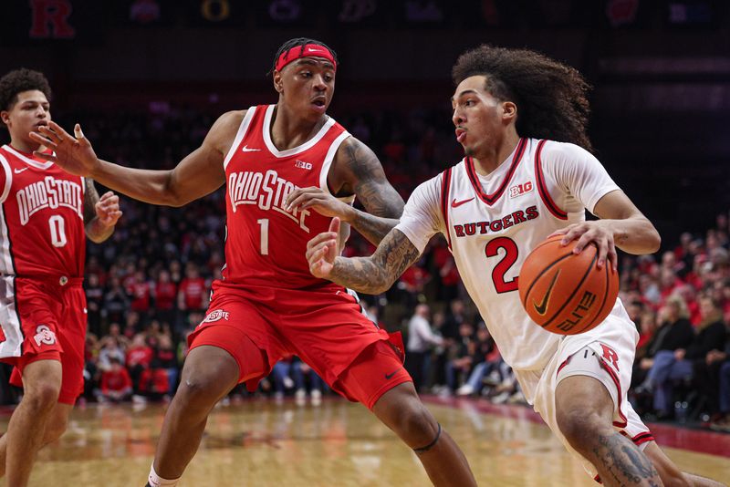 Jan 2, 2026; Piscataway, New Jersey, USA; Rutgers Scarlet Knights guard Lino Mark (2) goes to the basket against Ohio State Buckeyes forward Amare Bynum (1) during the second half at Jersey Mike's Arena. Mandatory Credit: Vincent Carchietta-Imagn Images