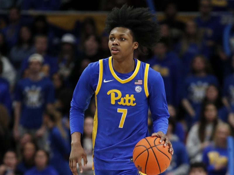 Feb 17, 2024; Pittsburgh, Pennsylvania, USA;  Pittsburgh Panthers guard Carlton Carrington (7) brings the ball up court against the Louisville Cardinals during the second half at the Petersen Events Center. Pittsburgh won 86-59. Mandatory Credit: Charles LeClaire-USA TODAY Sports