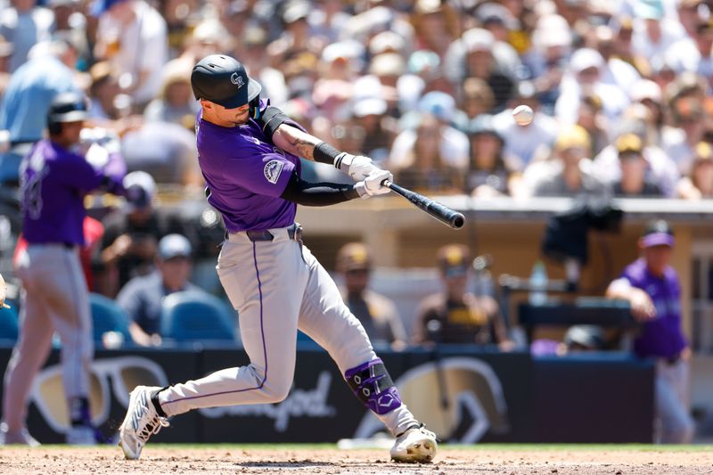 Aug 4, 2024; San Diego, California, USA; Colorado Rockies center fielder Brenton Doyle (9) hits a one run home run during the fourth inning against the San Diego Padres at Petco Park. Mandatory Credit: David Frerker-USA TODAY Sports