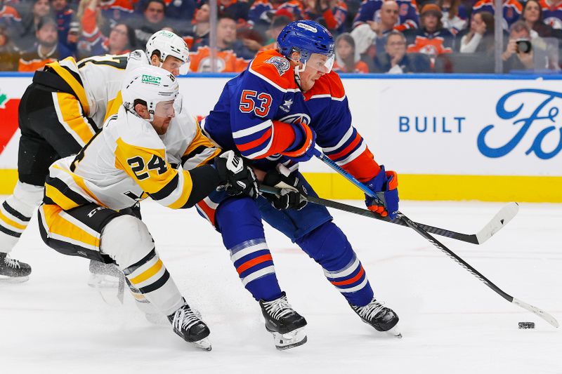 Oct 25, 2024; Edmonton, Alberta, CAN; Pittsburgh Penguins forward Rickard Rakell (67) hooks Edmonton Oilers forward Jeff Skinner (53) during the third period at Rogers Place. Mandatory Credit: Perry Nelson-Imagn Images