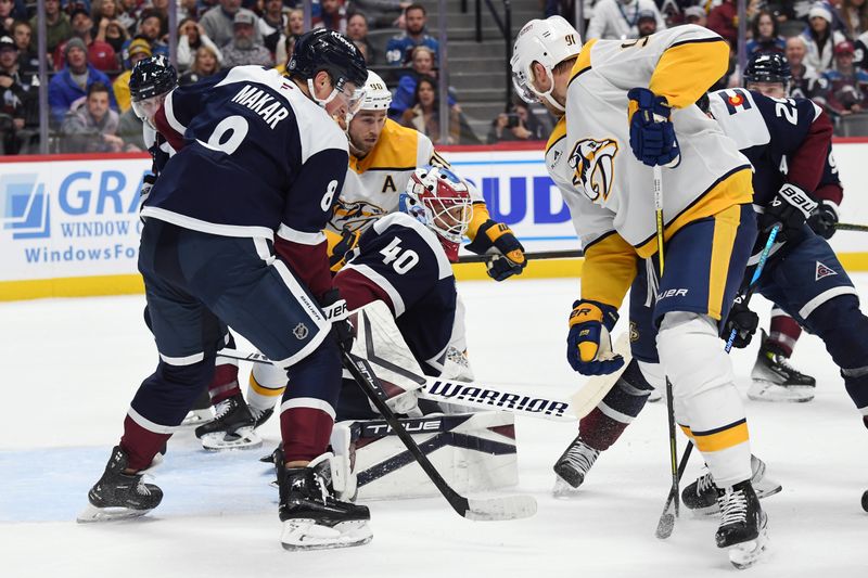 Nov 11, 2024; Denver, Colorado, USA; Colorado Avalanche goaltender Alexandar Georgiev (40) makes a save against Nashville Predators center Steven Stamkos (91) and center Ryan O'Reilly (90) during the first period at Ball Arena. Mandatory Credit: Christopher Hanewinckel-Imagn Images