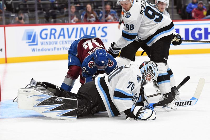 Sep 29, 2024; Denver, Colorado, USA; Utah Hockey Club goalie Karel Vejmelka (70) makes a save during the second period against the Colorado Avalanche at Ball Arena. Mandatory Credit: Christopher Hanewinckel-Imagn Images