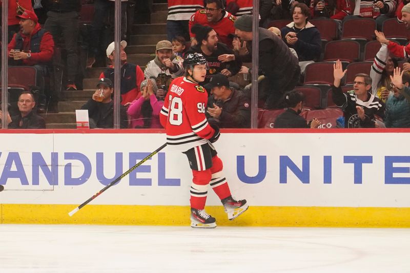 Dec 1, 2024; Chicago, Illinois, USA; Chicago Blackhawks center Connor Bedard (98) celebrates his goal against the Columbus Blue Jackets during the first period at United Center. Mandatory Credit: David Banks-Imagn Images