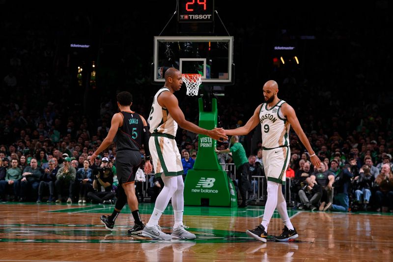 BOSTON, MA - FEBRUARY 9: Al Horford #42 and Derrick White #9 of the Boston Celtics celebrate during the game against the Washington Wizards on February 9, 2024 at the TD Garden in Boston, Massachusetts. NOTE TO USER: User expressly acknowledges and agrees that, by downloading and or using this photograph, User is consenting to the terms and conditions of the Getty Images License Agreement. Mandatory Copyright Notice: Copyright 2024 NBAE  (Photo by Brian Babineau/NBAE via Getty Images)